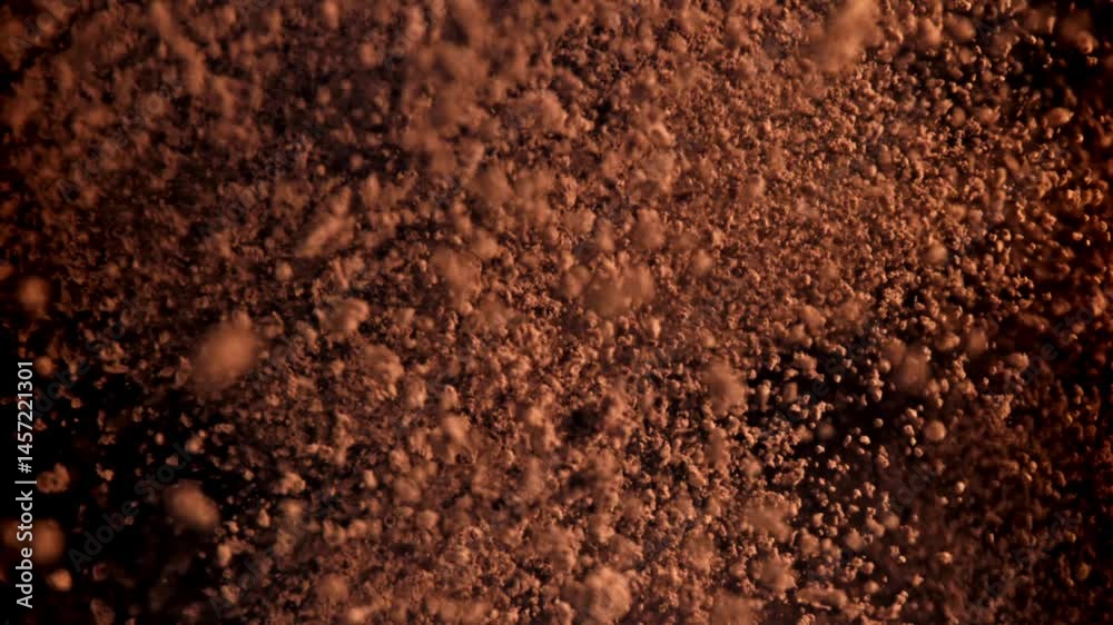 The cocoa powder flies up and down. Filmed on a high-speed camera at 1000 fps. High quality FullHD footage The cocoa powder flies up and down. Filmed on a high-speed camera at 1000 fps. High quality FullHD footage