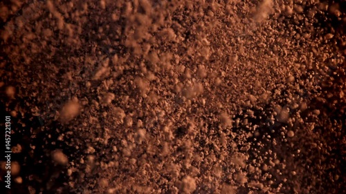The cocoa powder flies up and down. Filmed on a high-speed camera at 1000 fps. High quality FullHD footage