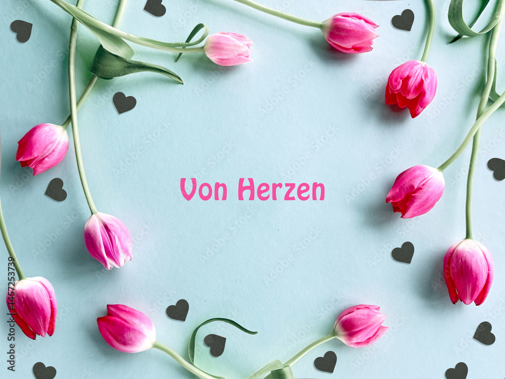 Pink tulips arranged in a circle with text