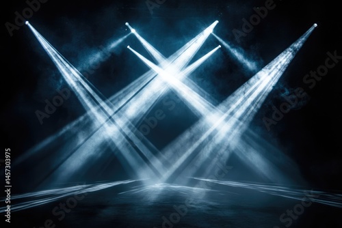 A dark stage illuminated by bright, converging spotlights piercing through hazy air, creating a dramatic and atmospheric effect.