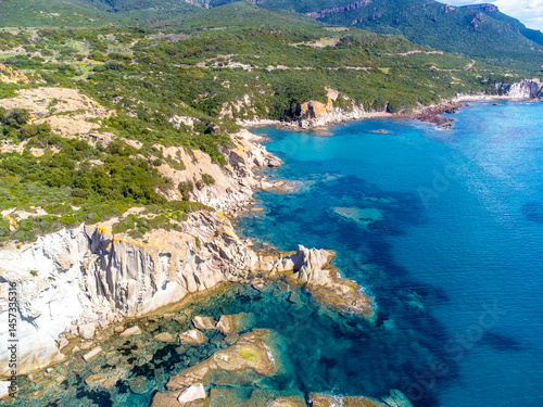 Obraz na płótnie Aerial view of Cala Cumpultittu rocky shoreline in springtime w salonie