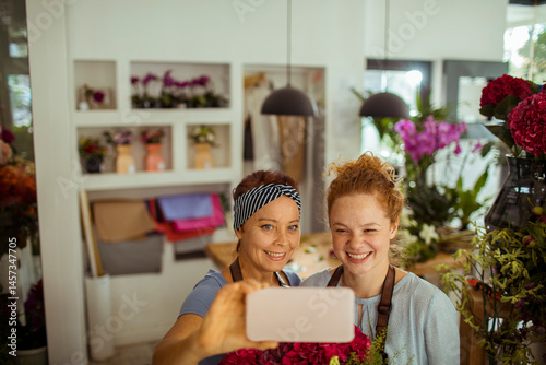 Wallpaper Mural Mother and daughter florists taking a selfie in their flower shop Torontodigital.ca