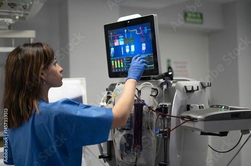 Medical professional operating advanced dialysis machine