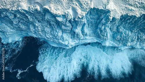 Aerial View of Glacial Ice Cliff and Ocean Waves