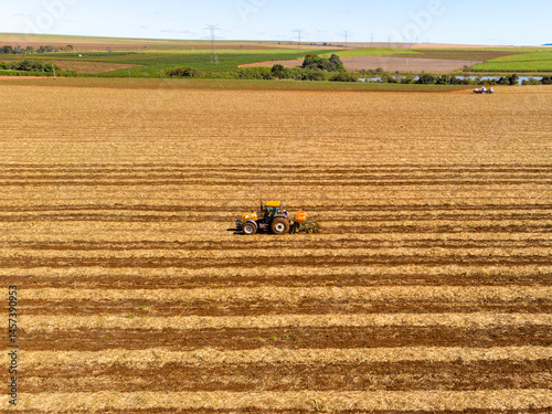 фотографія fertilizing land where sugar cane was planted aerial view