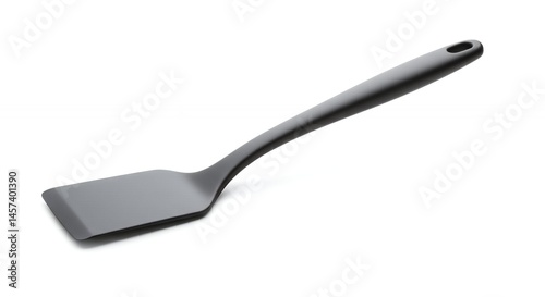 Dark gray spatula against white background