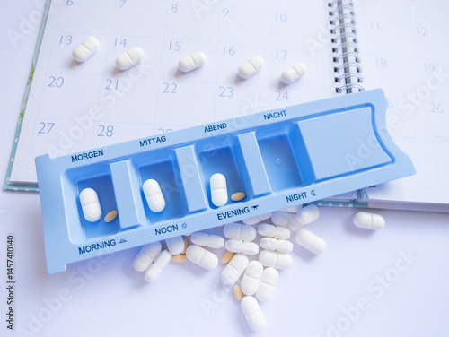 Tablets in a special pill box for each time of the day. A symbol of treatment planning and health care, especially for chronic conditions.