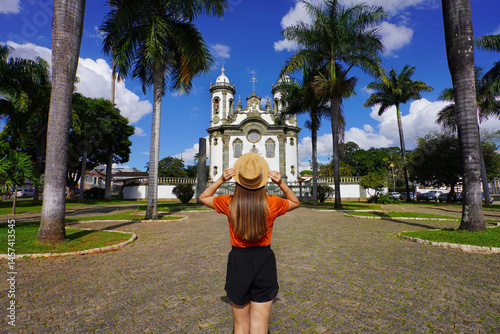Obraz na płótnie Brazilian Colonial Art. Traveler girl visits the church of Saint Francis of Assisi in the town of Sao Joao del-Rei, Minas Gerais, Brazil. w salonie
