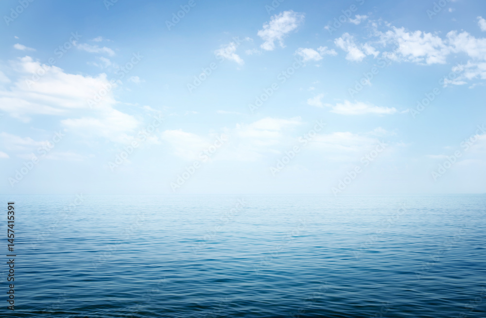 Fototapeta premium View of the sea or ocean and the sky with clouds. A good background for the theme of travel, summer vacation.