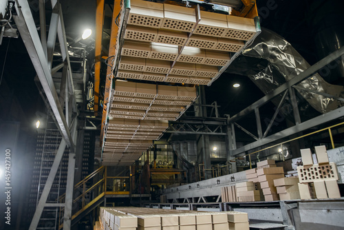 Tablou pe pânză Automated robot manipulator for gripping and transferring bricks to conveyor bel