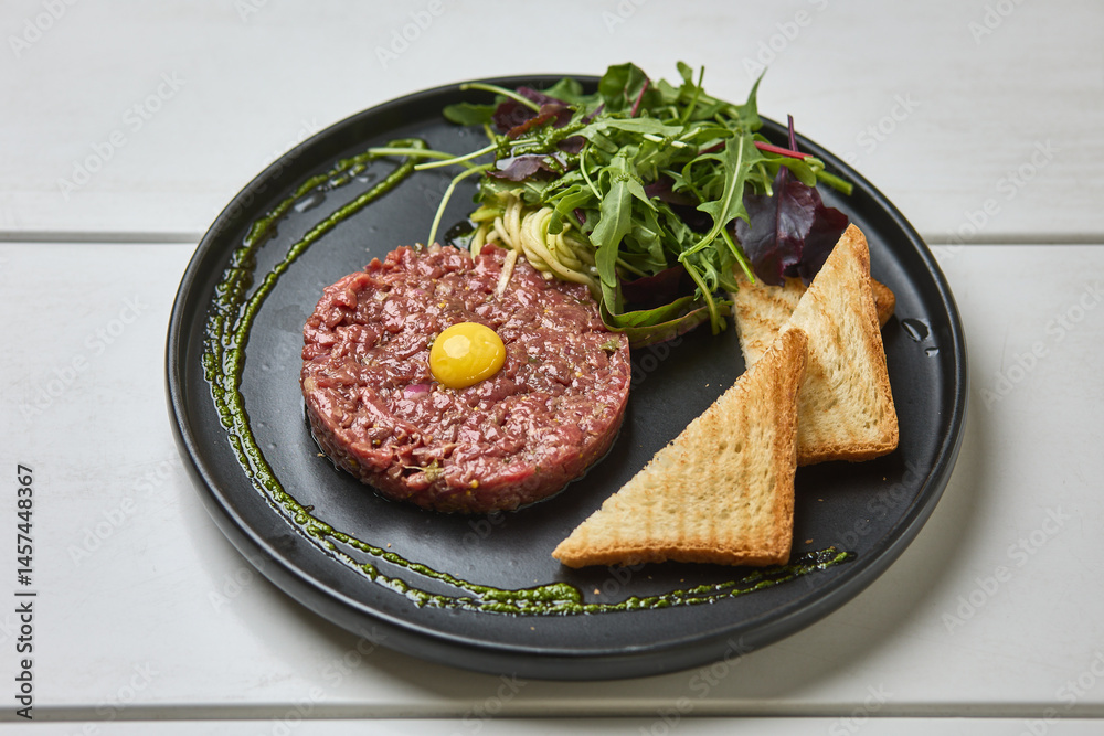 Beef tartare with quail egg and toast