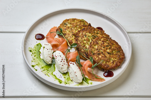 Obraz na płótnie Zucchini fritters with smoked salmon and cream cheese w salonie