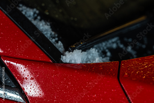 Obraz na płótnie hail accumulated on red car body. w salonie