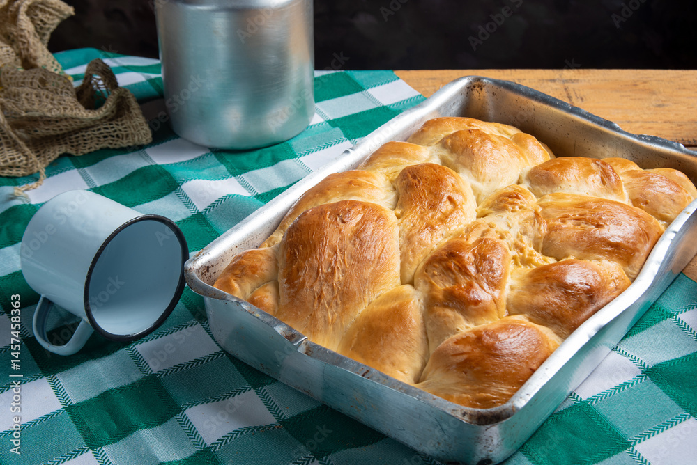 Homemade bread, a beautiful breakfast table with delicious homemade bread on a rustic wooden surface with a tablecloth, selective focus.