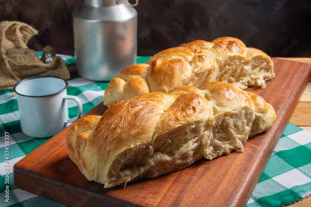 Homemade bread, a beautiful breakfast table with delicious homemade bread on a rustic wooden surface with a tablecloth, selective focus.
