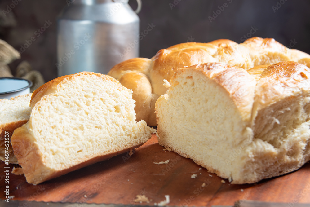 Homemade bread, a beautiful breakfast table with delicious homemade bread on a rustic wooden surface with a tablecloth, selective focus.