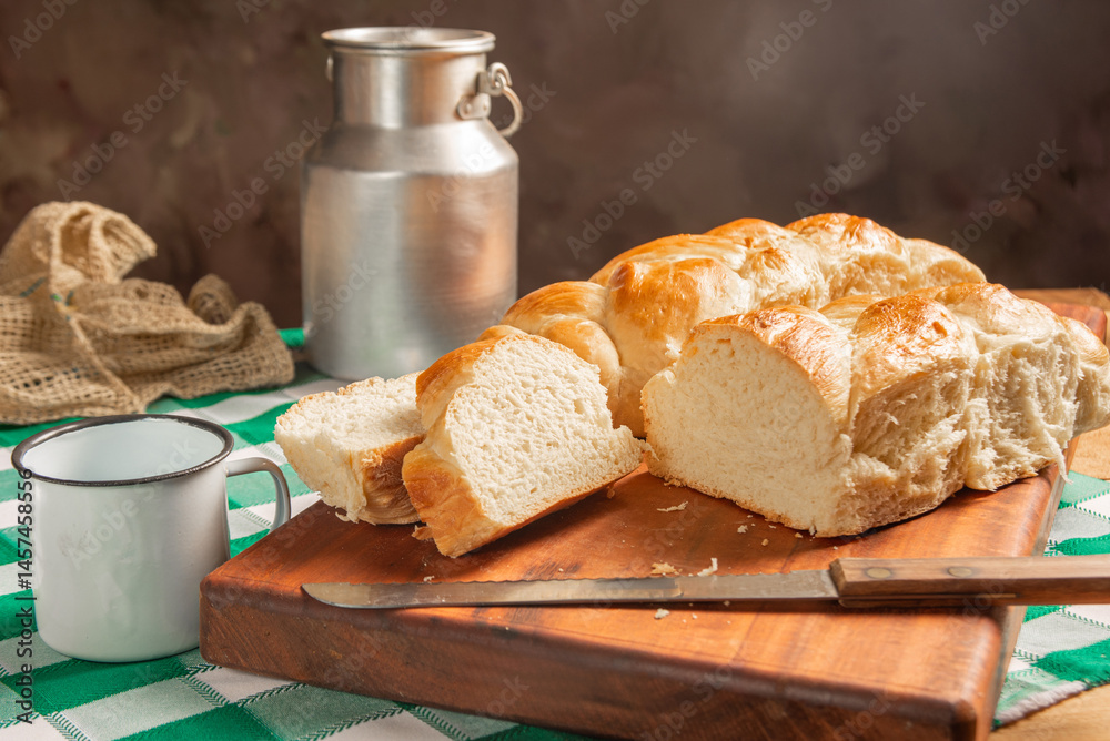 Homemade bread, a beautiful breakfast table with delicious homemade bread on a rustic wooden surface with a tablecloth, selective focus.