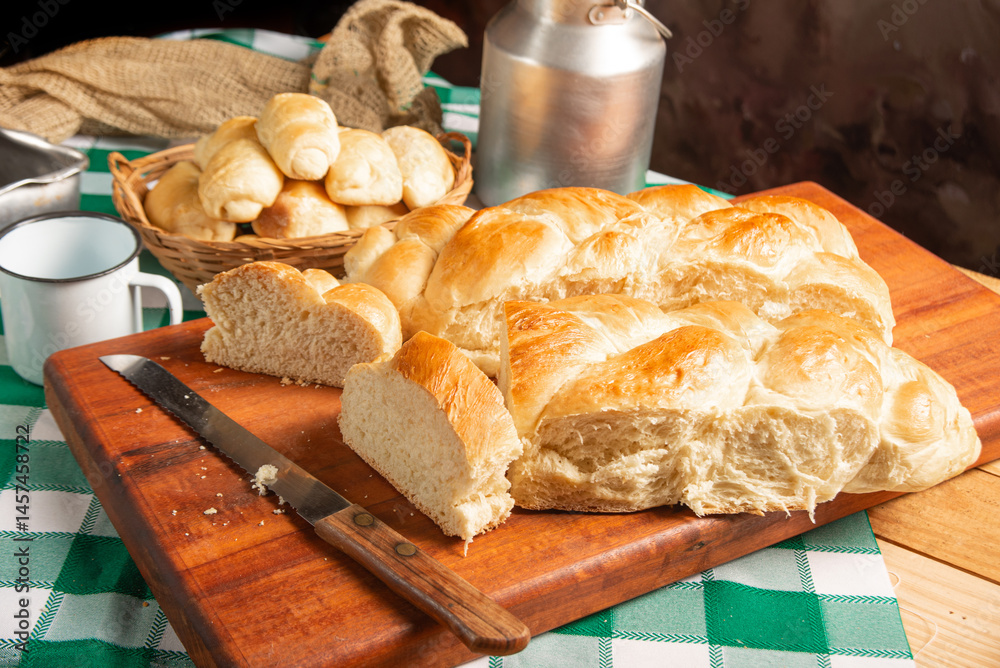 Homemade bread, a beautiful breakfast table with delicious homemade bread on a rustic wooden surface with a tablecloth, selective focus.