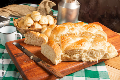 Obraz na płótnie Homemade bread, a beautiful breakfast table with delicious homemade bread on a rustic wooden surface with a tablecloth, selective focus. w salonie