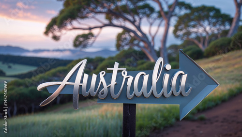 Obraz na płótnie on a pole a direction arrow with the inscription Australia against the backdrop of a picturesque landscape in summer w salonie