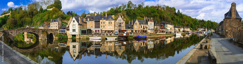 France travel, most scenic villages and romantic towns of Brittany. Picturesque traditional port of Dinan with half-timbered houses, restaurants over canals