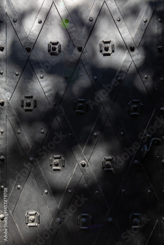 grunge metal background with rivets