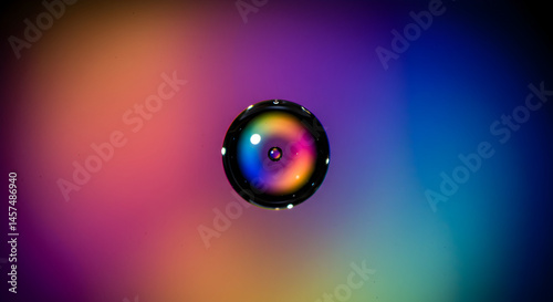 Abstract Reflection Of Vivid Colors Inside Water Drop On Gradient Surface