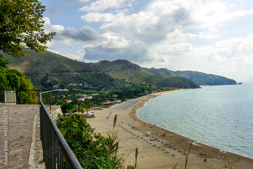 view from above on the Mediterranean Sea and the beach of the city of Sperlonga in Italy. Scenic resort town village with nice sand beach and clear blue water. Famous tourist destination