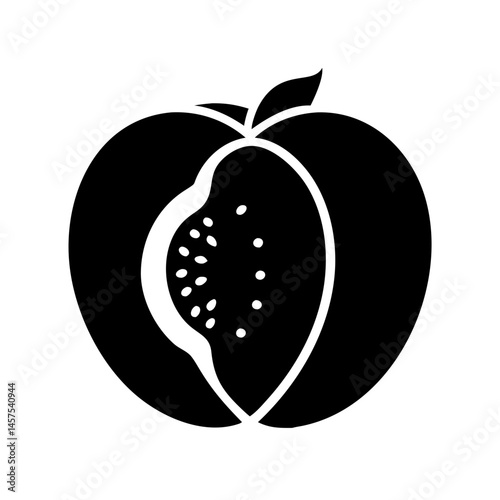 Black and white half sliced peach displaying the pit in center