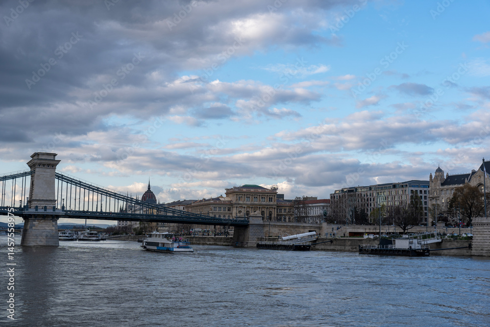Fototapeta premium Szechenyi Chain Bridge is chain bridge that spans river Danube between Buda and Pest district, western and eastern sides of Budapest, Hungary