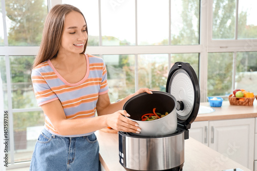 Young woman taking bowl wit...