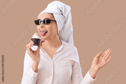 Young woman in pink pajamas...