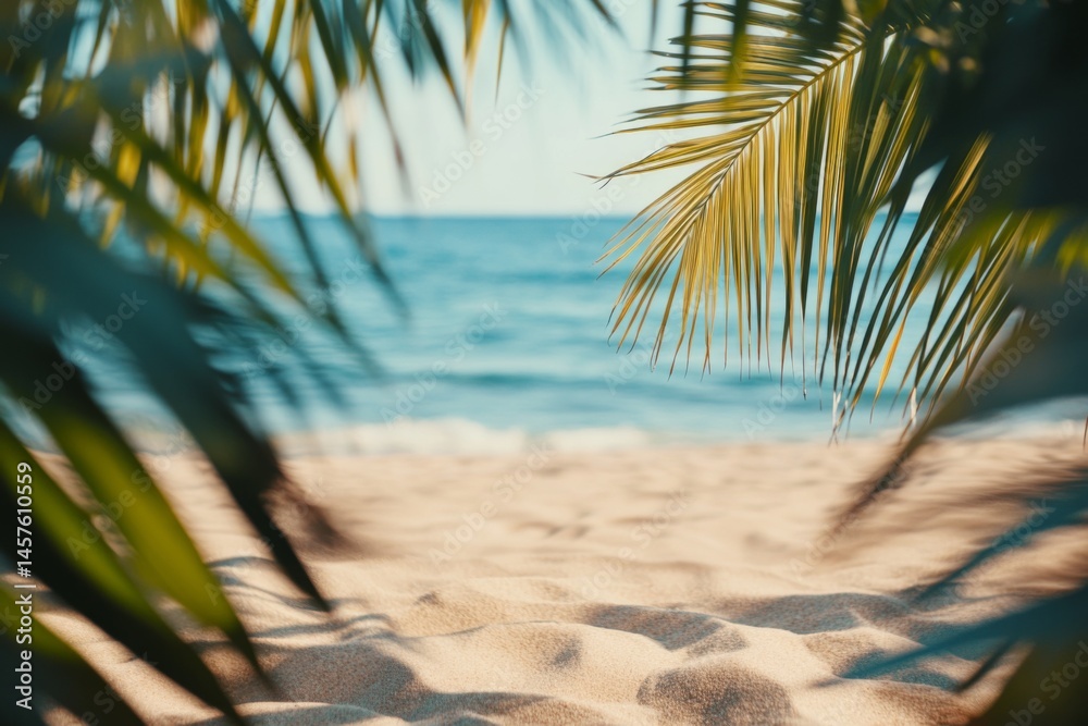 Fototapeta premium Tropical beach background with palm leaves and sand, blurred sea view. Summer vacation concept banner.