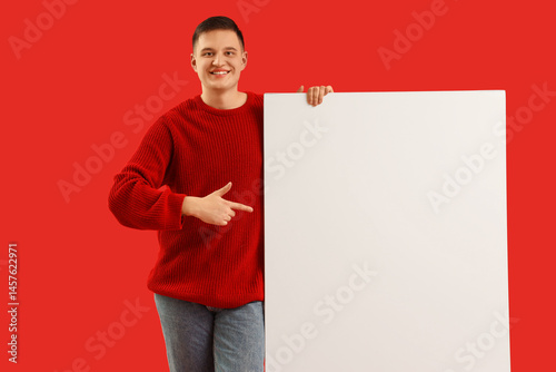 Handsome young man pointing...