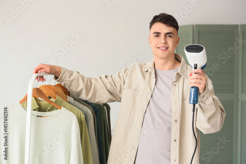 Young man with steamer and ...