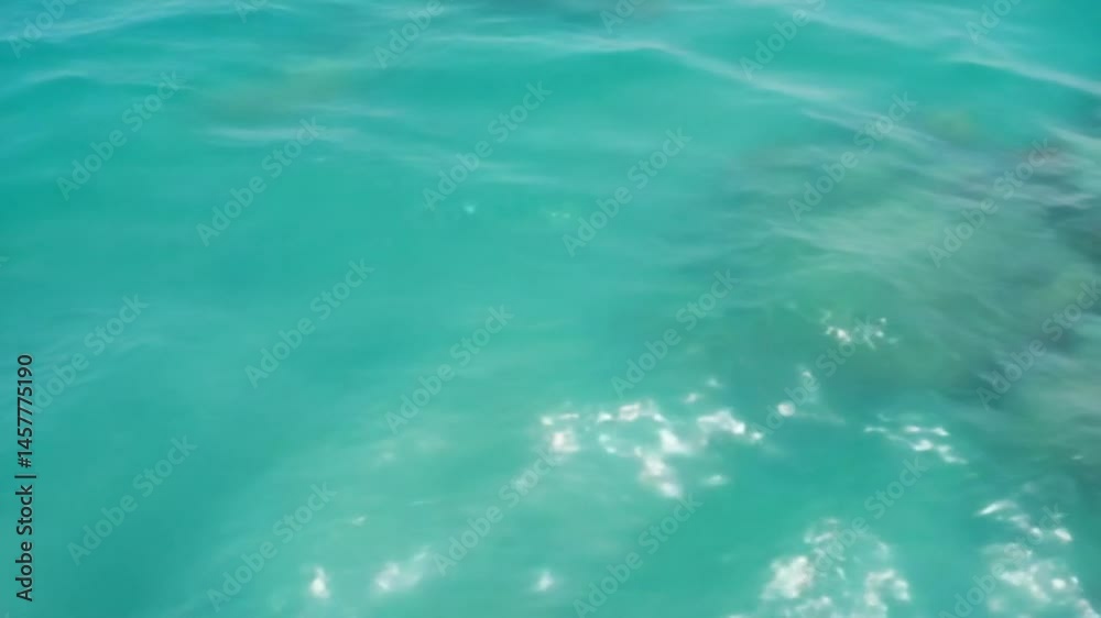 A summer beach-themed abstract bokeh background featuring the blue sea A summer beach-themed abstract bokeh background featuring the blue sea