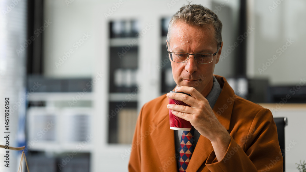 An elderly Caucasian male lawyer works at his desk in a law firm, offering legal advice and business law services. A gavel and documents symbolize justice and professionalism