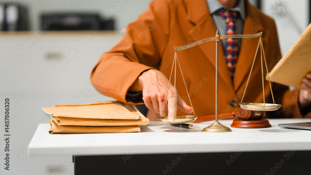 An elderly Caucasian male lawyer works at his desk in a law firm, offering legal advice and business law services. A gavel and documents symbolize justice and professionalism