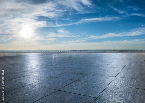 Empty square floor and city skyline with beautiful sky clouds on a sunny day