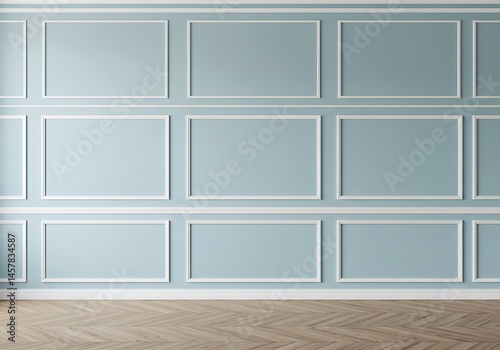 A light blue wall with white decorative molding and a parquet wood floor in a simple room setting