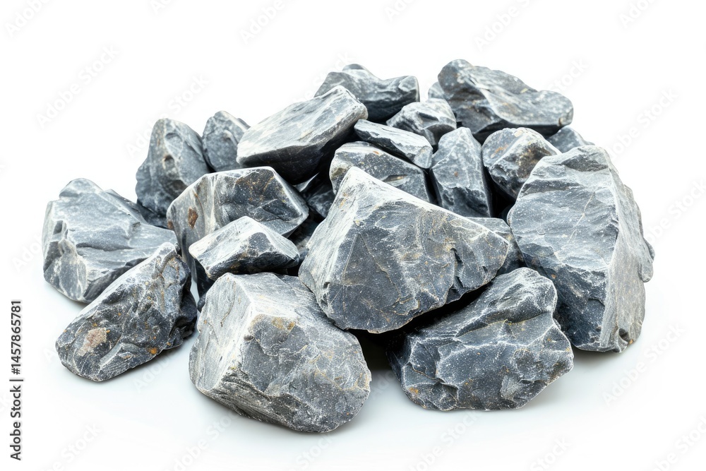 A pile of dark gray rocks, showcasing their rugged texture and natural form. on white background A pile of dark gray rocks, showcasing their rugged texture and natural form. on white background