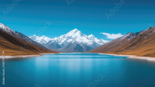 Majestic Snow-Capped Mountain Reflecting in Serene Blue Lake