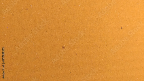 Background of brown kraft paper or cardboard texture. Abstract pattern of beige rough carton, old paper sheet.