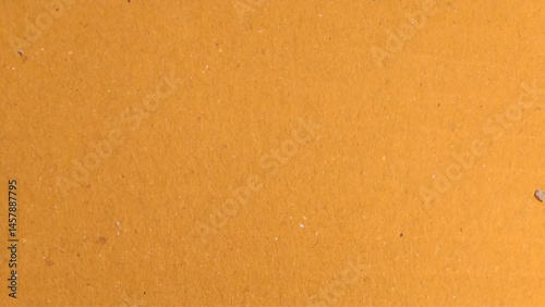 Background of brown kraft paper or cardboard texture. Abstract pattern of beige rough carton, old paper sheet.