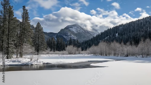 Wallpaper Mural Snowy Mountain Landscape with Frozen Lake Under a Cloudy Blue Sky in Winter Torontodigital.ca