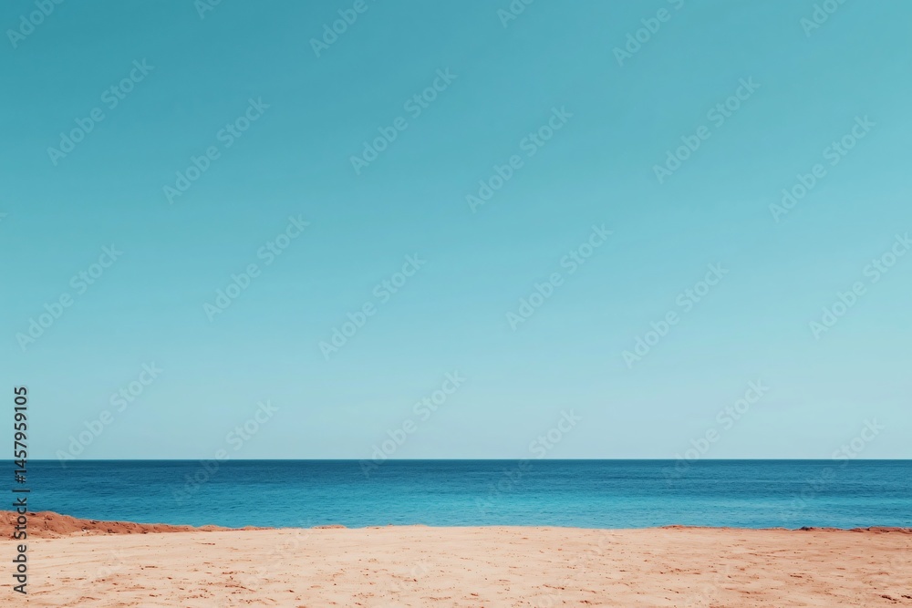 Obraz premium Serene Seascape Tranquil Ocean View with Sandy Beach under a Clear Blue Sky