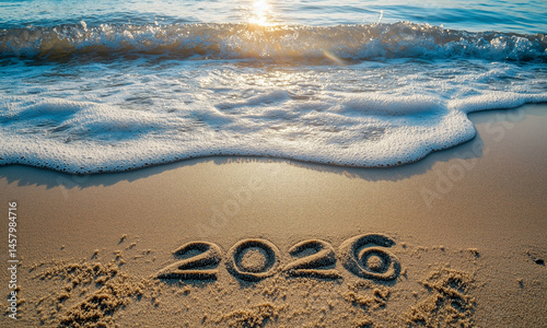 2026 number written in sand on a beach, symbolising celebration, new year concept