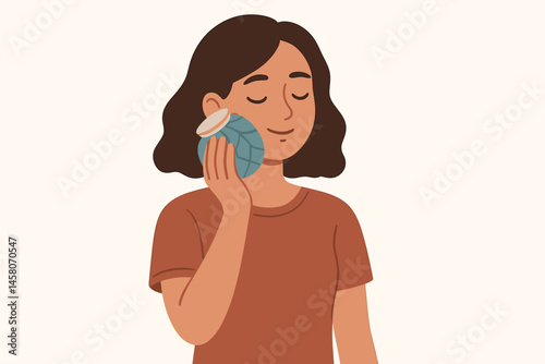Woman comforting herself with a cold pack on her face  