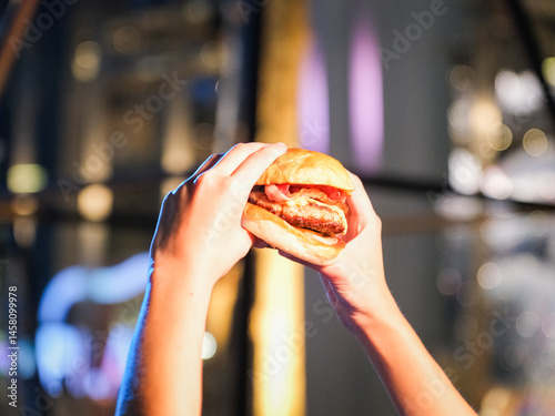 Burger on hands