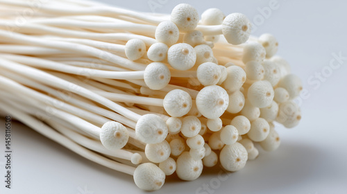 Enoki Mushroom Close Up: A detailed view of fresh enoki mushrooms, their delicate, slender stems and rounded caps creating an inviting, textural composition.